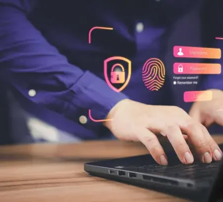 Man Typing passwords, implementing Two-Factor Authentication
