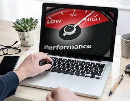 Speedometer gauge with glowing dial symbolizing improved WordPress site speed and performance.